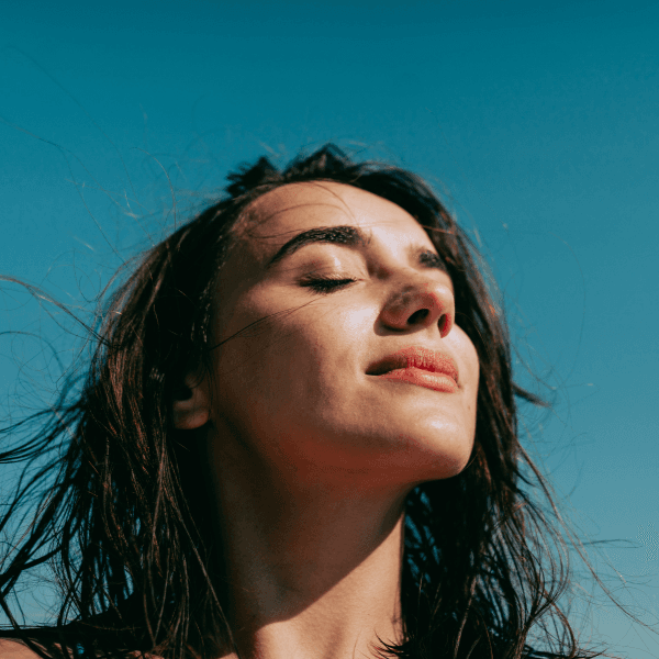 A person finding a moment of calm, representing relief from breathing difficulties.